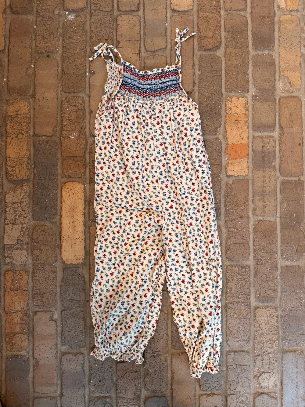 Doen Cream Floral Smocked Jumpsuit with Red and Blue Print
